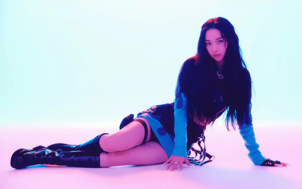 HD desktop wallpaper featuring Karina from Aespa in a stylish pose, blending music and modern aesthetics with vibrant lighting.