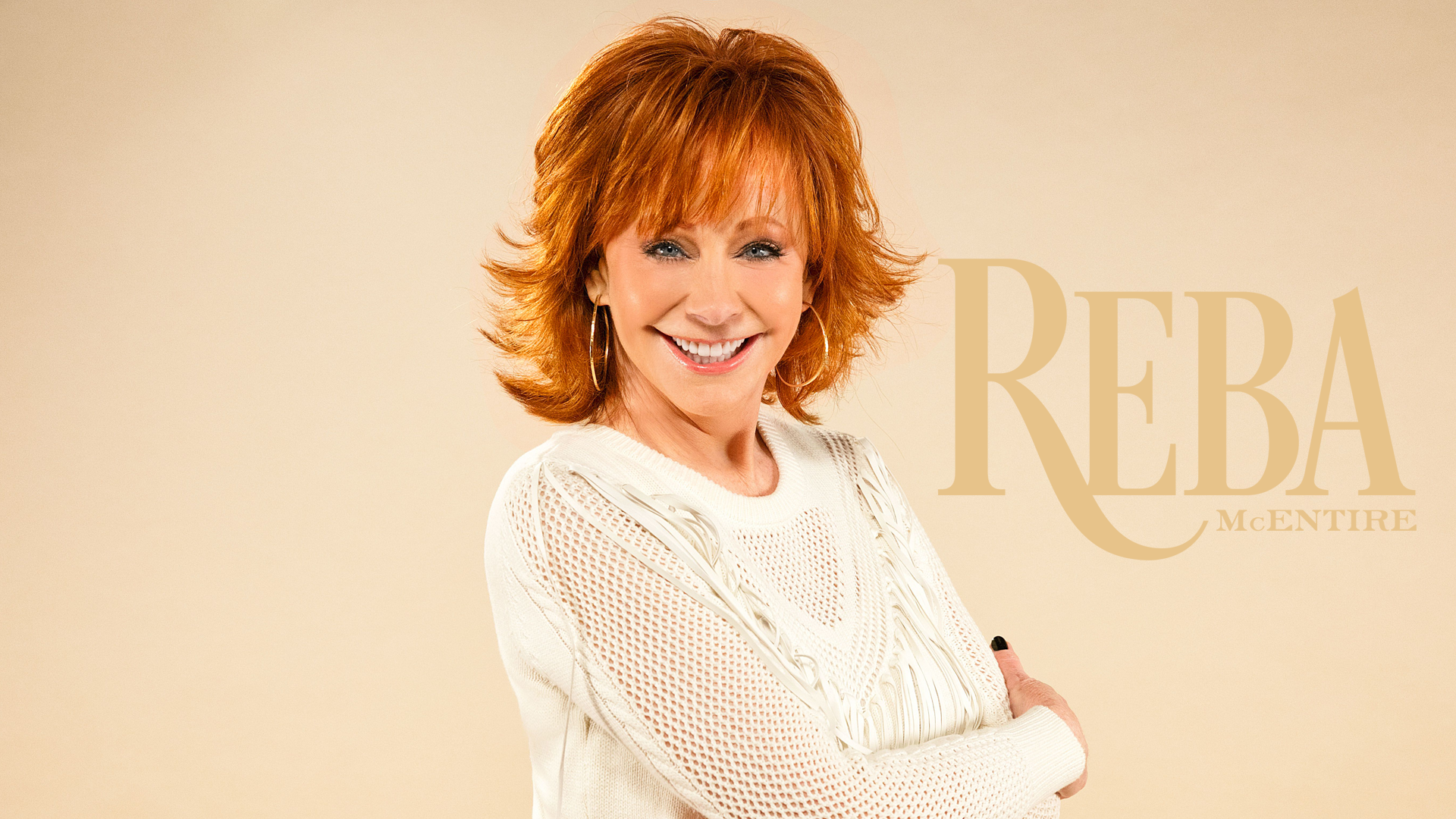 Smiling woman wearing a white sweater posing for a HD desktop wallpaper with stylized text.