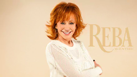 Smiling woman wearing a white sweater posing for a HD desktop wallpaper with stylized text.