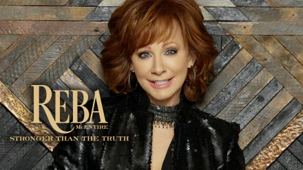 HD desktop wallpaper featuring a styled woman with auburn hair and black attire against a geometric wooden backdrop with the text 'REBA Stronger Than The Truth.'