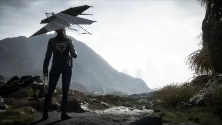 4K Ultra HD Death Stranding PC wallpaper featuring a lone figure holding a futuristic umbrella, standing on a rocky terrain with misty mountains in the background.