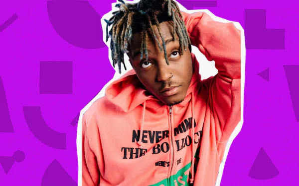 HD desktop wallpaper of Juice Wrld with a vibrant purple background, wearing a pink hoodie.