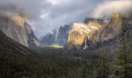 A breathtaking 8K Ultra HD view of Yosemite National Park’s valley, showcasing towering cliffs, misty clouds, and lush forest under dramatic lighting.