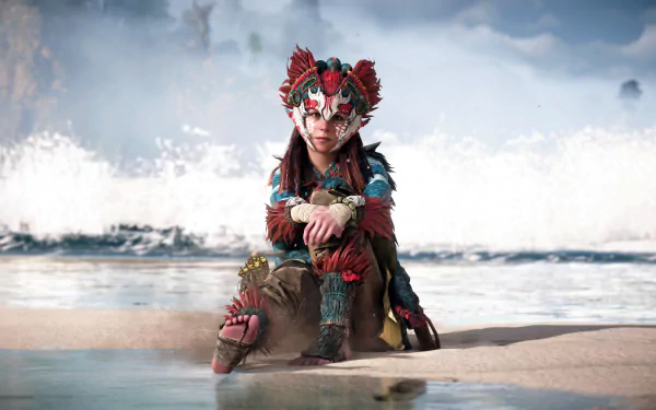 Aloy from Horizon Forbidden West sits on a beach with waves crashing behind her in this 4K Ultra HD PC desktop wallpaper from the Horizon video game series.