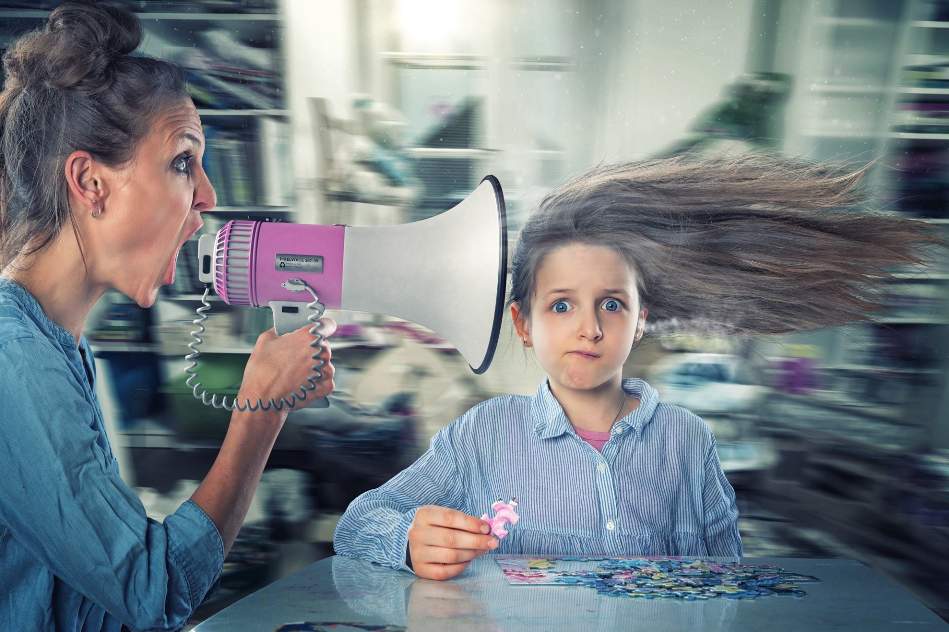 HD desktop wallpaper showing a funny scene where a woman using a pink megaphone blows a child's hair dramatically backward as the child calmly assembles a puzzle.