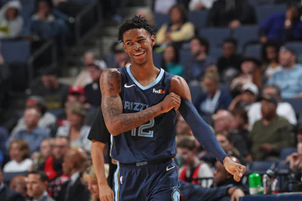 HD PC desktop wallpaper featuring basketball player Ja Morant in his Memphis Grizzlies uniform during a game, capturing a lively sports moment.
