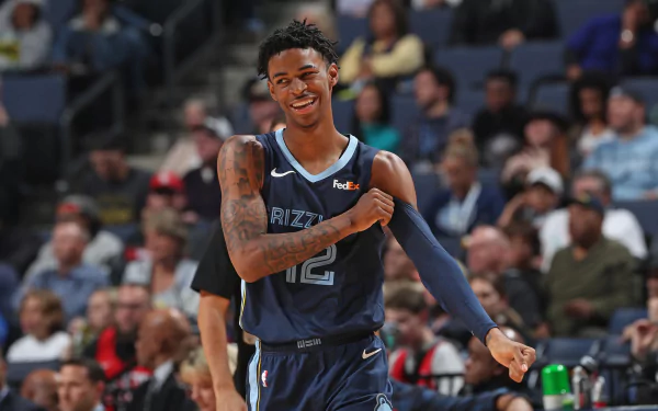 HD PC desktop wallpaper featuring basketball player Ja Morant in his Memphis Grizzlies uniform during a game, capturing a lively sports moment.