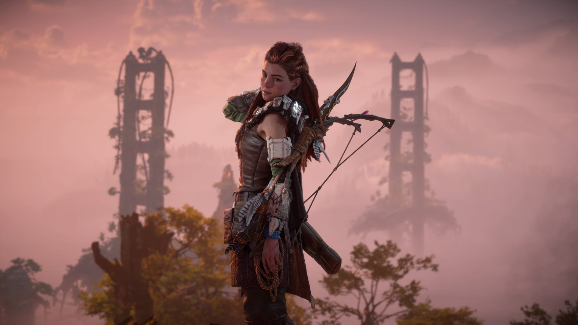 Aloy from Horizon Forbidden West stands with her bow before a ruined Golden Gate Bridge at sunset — 4K Ultra HD PC desktop wallpaper.