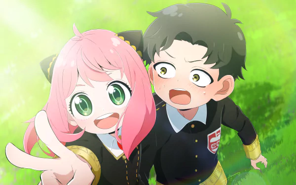 Anya Forger flashes a peace sign beside a startled Damian Desmond in school uniforms on sunlit grass — Spy x Family anime, 4K Ultra HD PC desktop wallpaper.