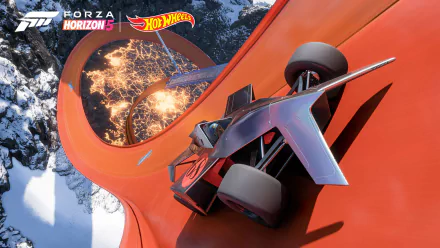 Forza Horizon 5 Hot Wheels video game 4K Ultra HD PC desktop wallpaper: futuristic race car on an orange Hot Wheels loop soaring over snowy mountains.