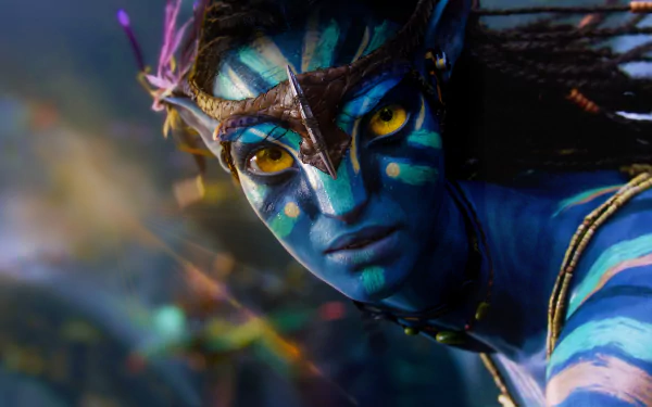 Close-up of a Na'vi character from the movie Avatar in vibrant colors, displayed as an 8K Ultra HD PC desktop wallpaper background.