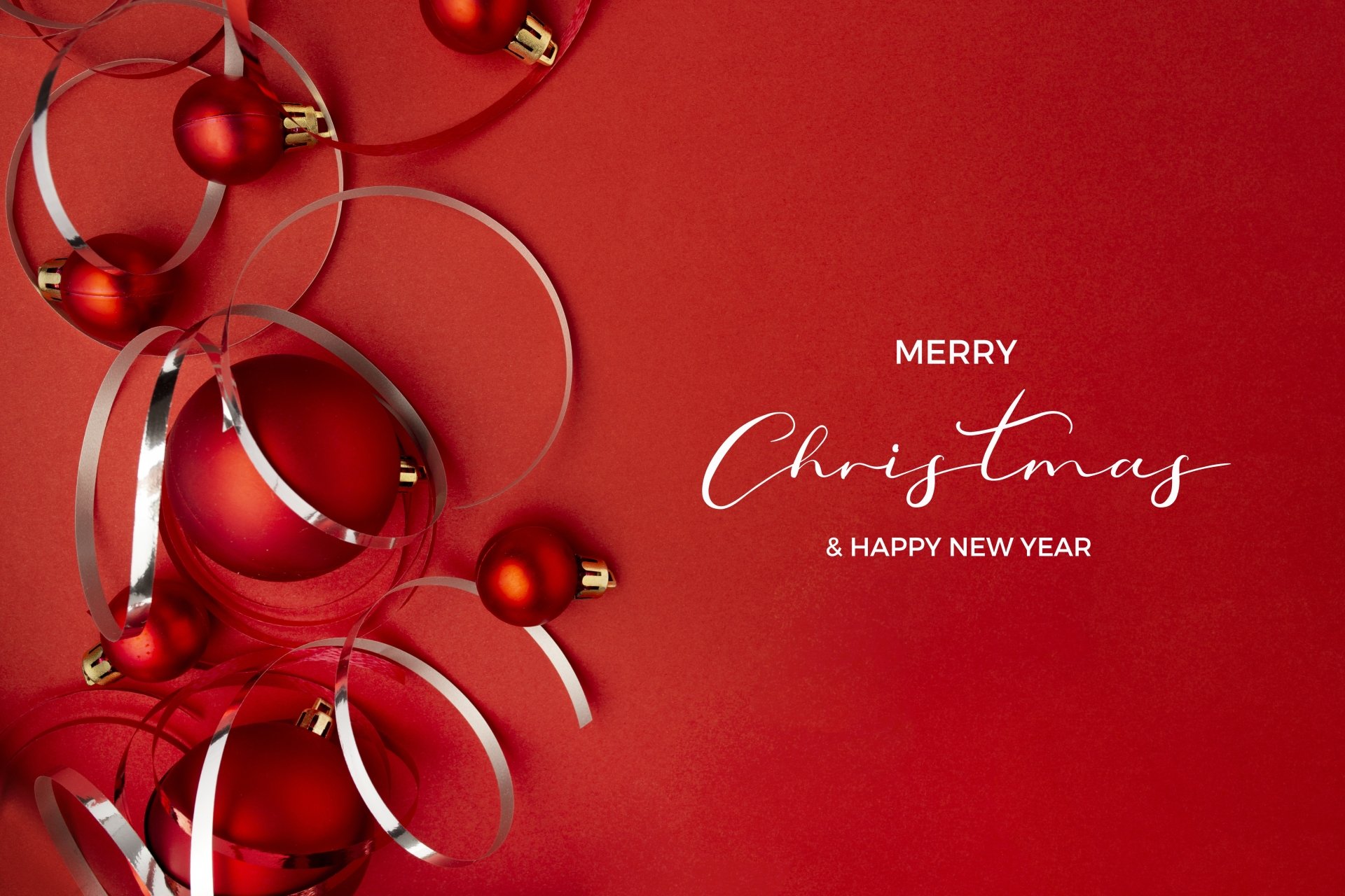 Merry Christmas and Happy New Year message with red Christmas baubles and silver ribbons on a red background, 4K Ultra HD PC desktop wallpaper.