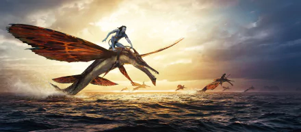 HD desktop wallpaper featuring a scene from the movie Avatar: The Way of Water, showing Na'vi characters riding flying creatures over the ocean at sunset.