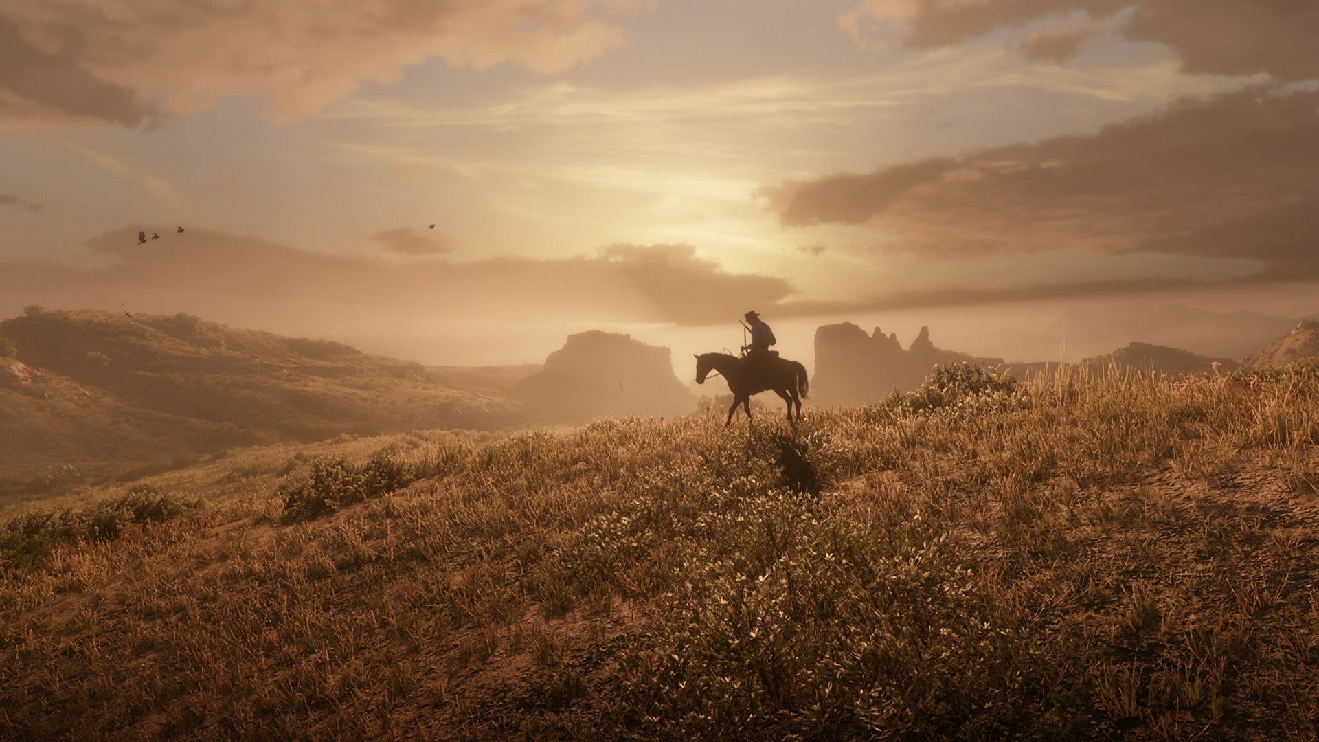 HD PC desktop wallpaper featuring a lone rider on horseback in a vast, sunlit landscape from the video game Red Dead Redemption 2.
