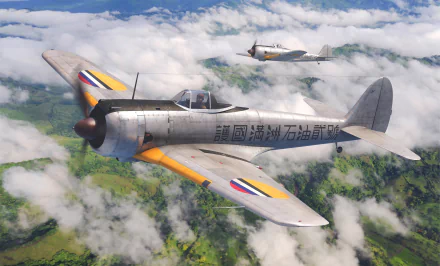 4K Ultra HD desktop wallpaper featuring two Nakajima Ki-43 Hayabusa military aircraft flying above clouds and a green landscape.