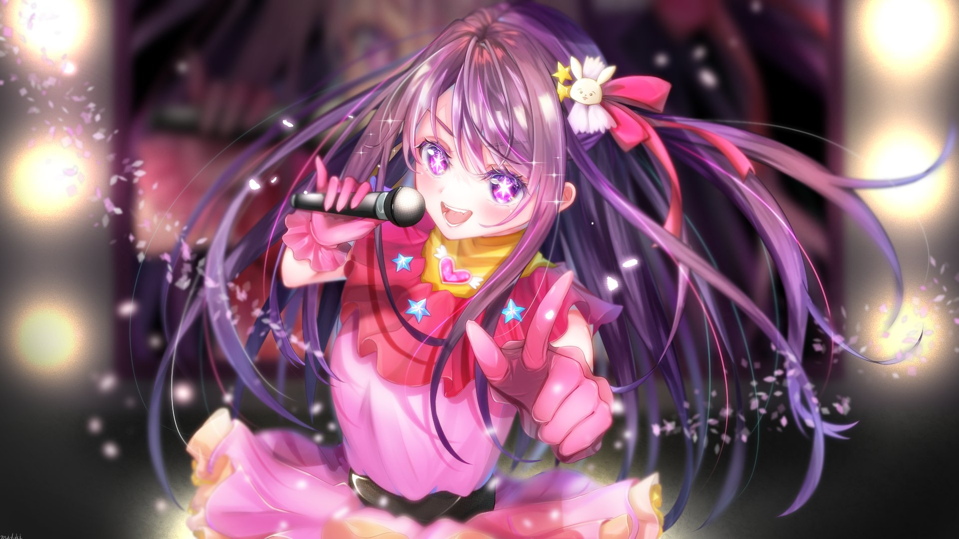 HD PC desktop wallpaper of Ai Hoshino from Oshi no Ko — anime idol in a pink outfit, long purple hair with ribbons, singing into a microphone amid sparkling stage lights.