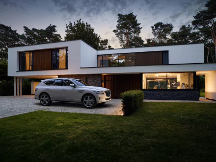 A Genesis GV80 parked in front of a modern house at dusk, captured in stunning 4K Ultra HD as a PC desktop wallpaper and background.