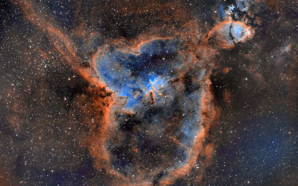 Heart Nebula with a vivid blue core and red‑orange filaments across a glittering starfield — sci‑fi nebula scene, 4K Ultra HD PC desktop wallpaper and background.