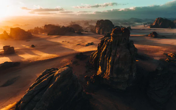 A breathtaking desert landscape featuring golden sand dunes under a clear blue sky, perfect for a HD desktop wallpaper.