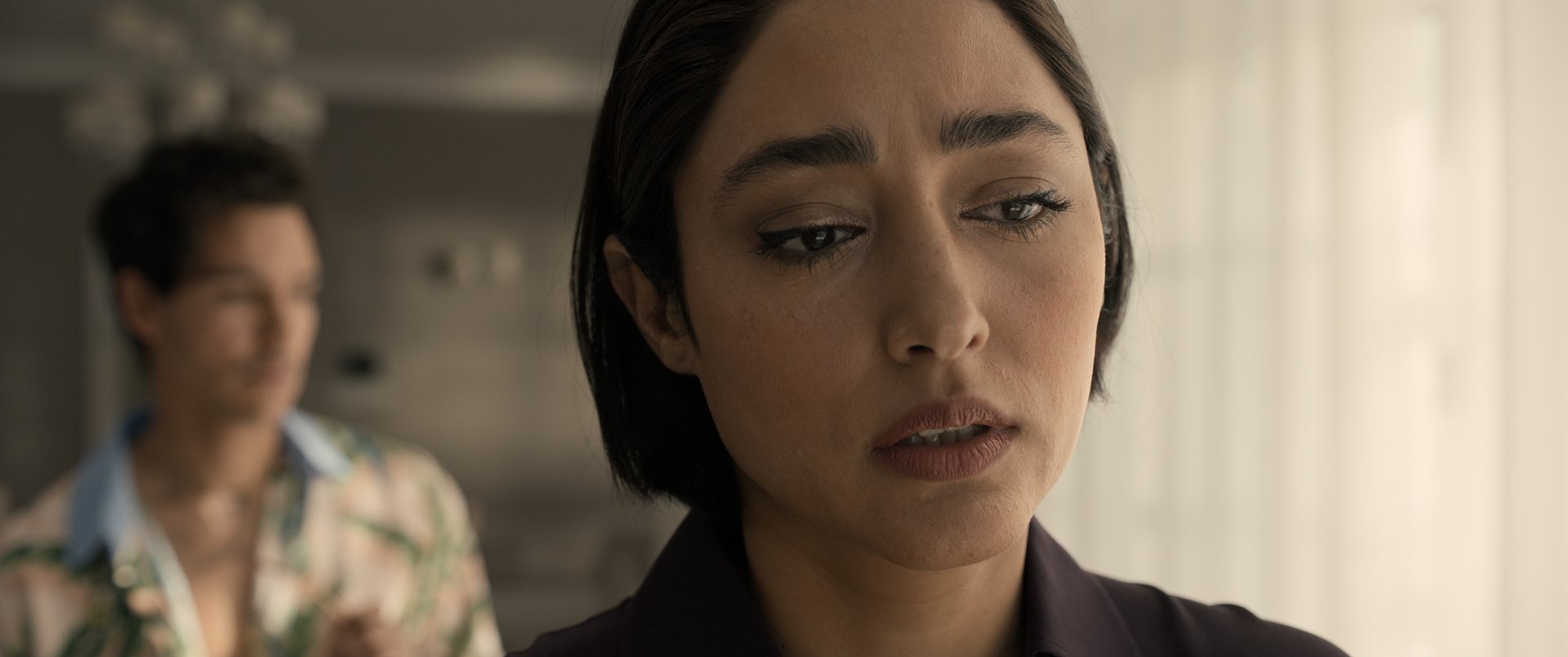 Golshifteh Farahani in a poignant moment from the movie Extraction 2. This HD desktop wallpaper captures her intense expression, highlighting the film's dramatic tone.