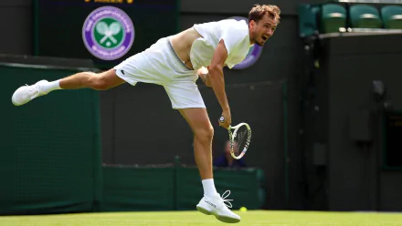 Daniil Medvedev in action at Wimbledon 2023, captured in a high-definition desktop wallpaper and background.