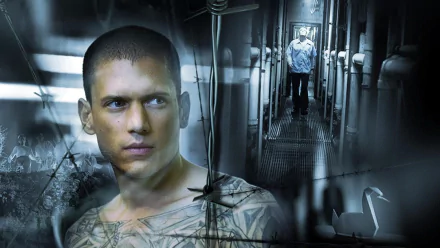 HD desktop wallpaper featuring Michael Scofield from the TV show Prison Break, with a close-up and a prison corridor background.
