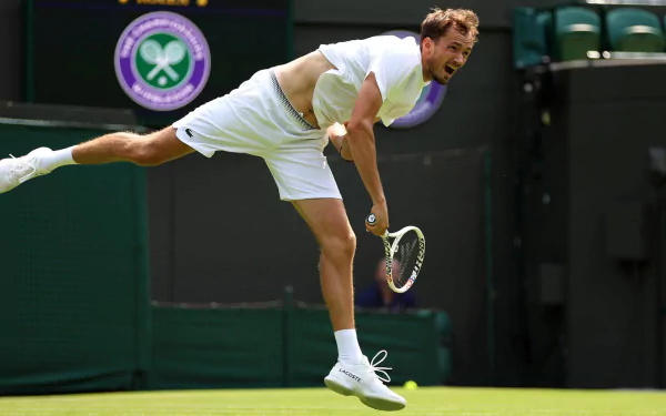 Daniil Medvedev in action at Wimbledon 2023, captured in a high-definition desktop wallpaper and background.