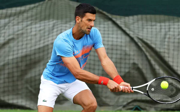 Tennis player in action at Wimbledon 2023, HD desktop wallpaper.