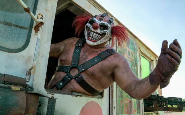 HD wallpaper featuring a Twisted Metal character resembling clown mask-wearing Joe Seanoa leaning out of a vehicle window