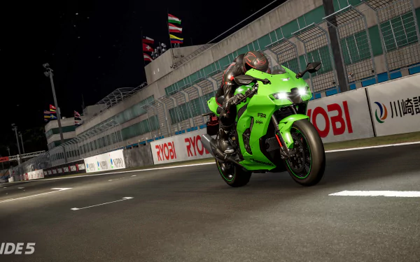 HD wallpaper from the video game Ride 5 featuring a motorcyclist racing at night on a vividly illuminated track.