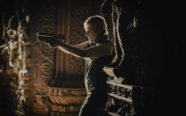 HD wallpaper of a character aiming a gun with intense focus, set against a detailed carved backdrop, from 'The Creator (2023)' for desktop backgrounds.