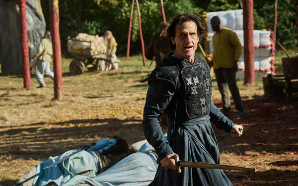 HD wallpaper of a scene from The Winter King featuring a tense moment with a character in a medieval setting.