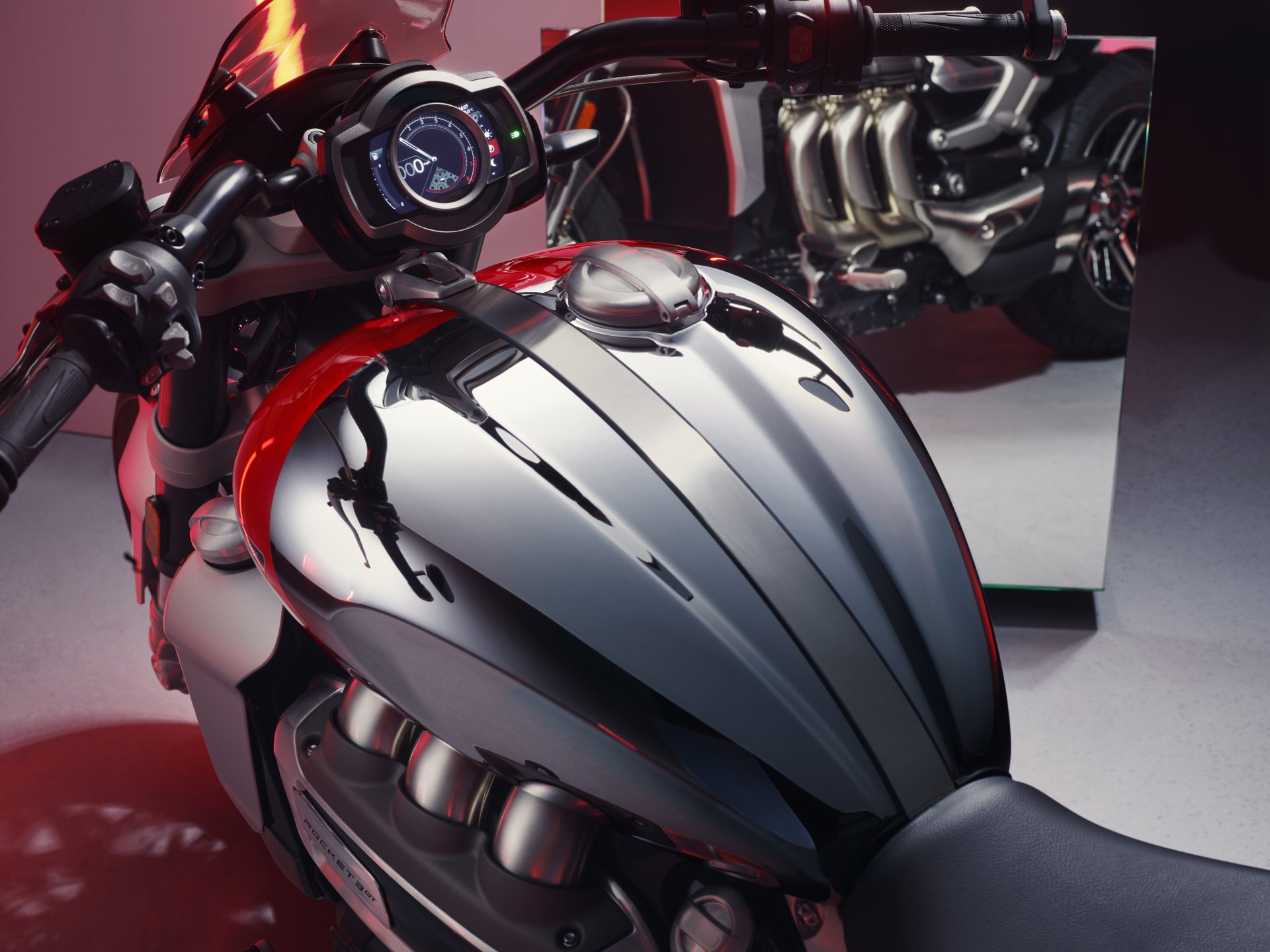 HD desktop wallpaper featuring a close-up of the Triumph Rocket III GT Chrome Edition's sleek chrome tank and engine details.