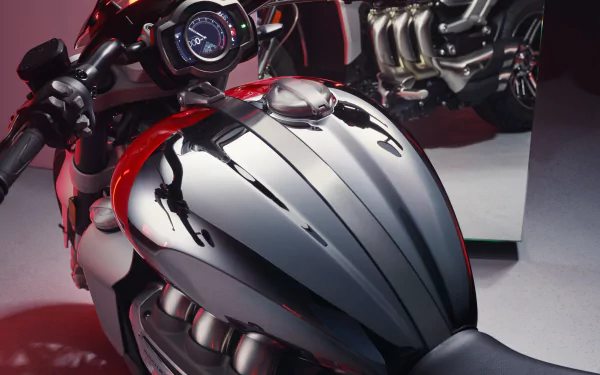 HD desktop wallpaper featuring a close-up of the Triumph Rocket III GT Chrome Edition's sleek chrome tank and engine details.