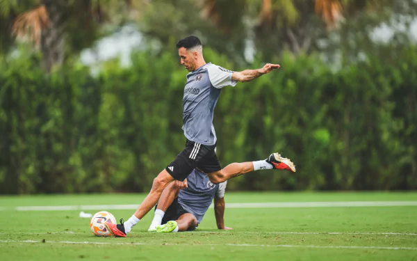 Sergio Busquets of Inter Miami CF performs a skillful move during a training session, showcased in this vibrant HD desktop wallpaper.