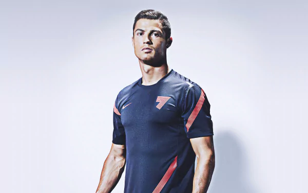 High-definition desktop wallpaper featuring an athletic male figure in a dark sports jersey with the number 7, against a minimalist grey background.