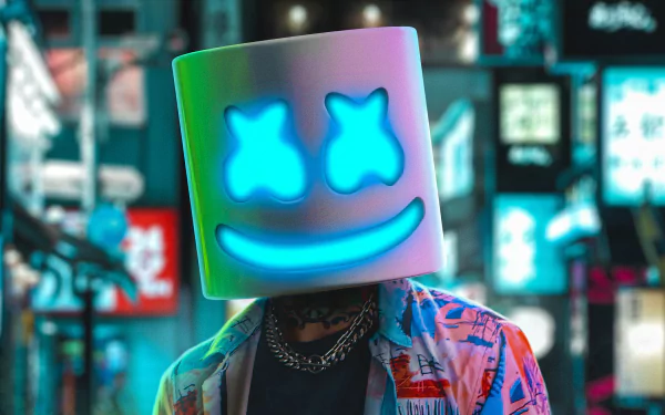 HD desktop wallpaper featuring a person with a Marshmello helmet, sporting a glowing smile and blue X eyes, set against a vibrant, blurred city background for a cool and urban vibe.