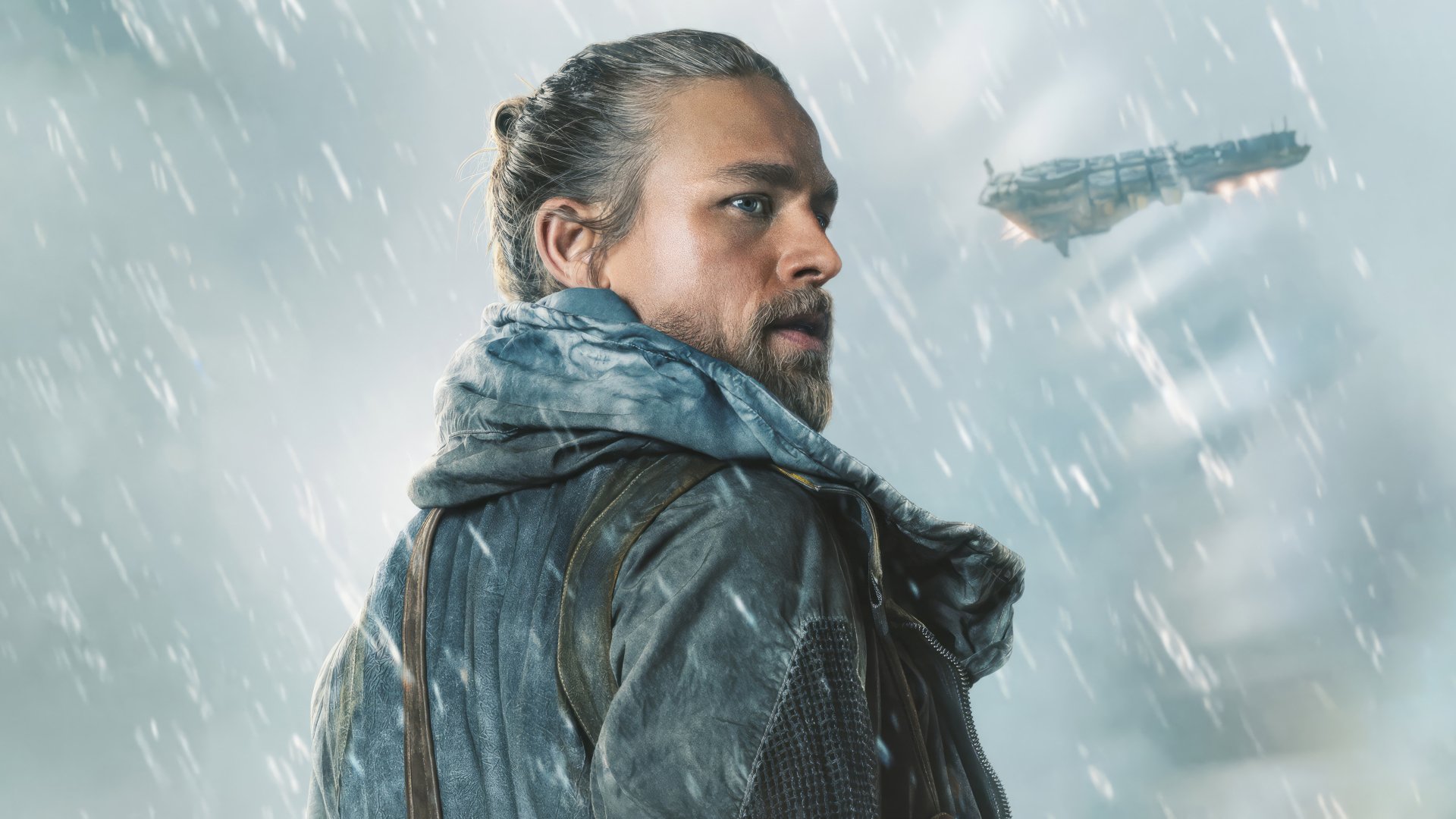 Charlie Hunnam in Rebel Moon, intense gaze with spacecraft backdrop, HD desktop wallpaper.