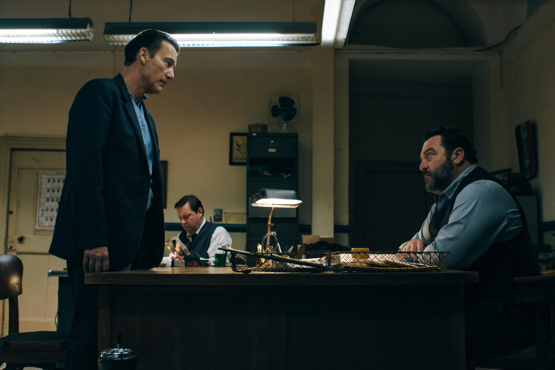 HD desktop wallpaper featuring a scene from the TV Show Monsieur Spade with two characters in an office setting.