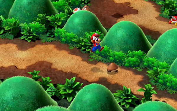 HD desktop wallpaper of Super Mario RPG (2023) featuring Mario in a vibrant forest environment with iconic green hills and game characters.