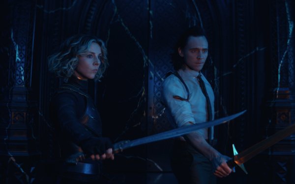 HD wallpaper featuring two characters holding weapons, in a dark setting with intricate designs, tagged with Loki for desktop background.