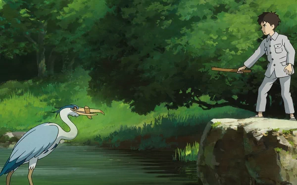 HD wallpaper of 'The Boy and the Heron' featuring animated boy offering food to a heron by a river with lush greenery in the background.