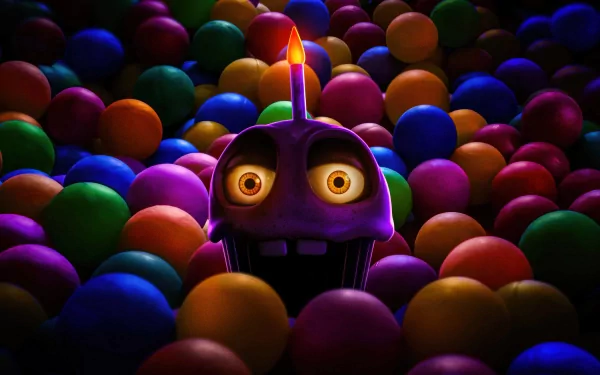 HD wallpaper of a Five Nights at Freddy's character peeking out from a colorful ball pit with a menacing expression, perfect for a desktop background.