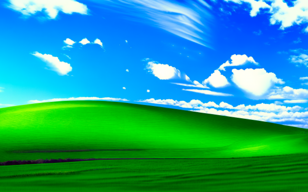 HD Windows XP Bliss wallpaper featuring iconic green hill and blue sky with clouds, perfect Microsoft nostalgic desktop background.