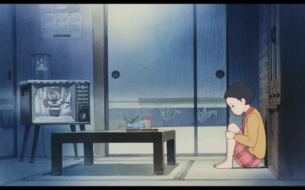 A calm, nostalgic scene from Studio Ghibli's Only Yesterday anime, showing a young girl sitting on the floor in a softly lit traditional Japanese room with an old TV.