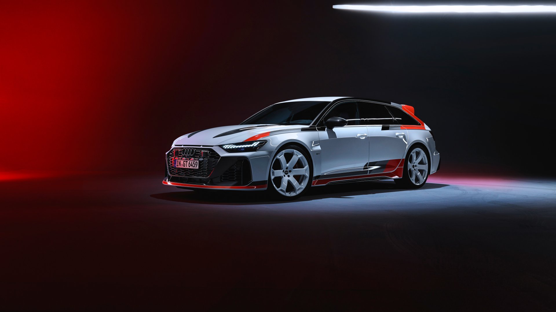 A sleek Audi RS6 Avant GT showcased against a dramatic dark background with vibrant lighting, making for a striking HD desktop wallpaper and background.