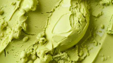 Close-up of vibrant green gelato with a creamy texture, showcased as an HD desktop wallpaper and background, inviting a fresh and delightful aesthetic.