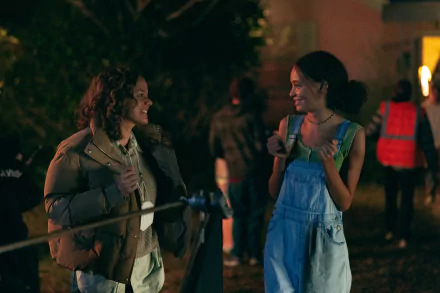 HD wallpaper from the 2024 movie Suncoast featuring two characters smiling and chatting at night.