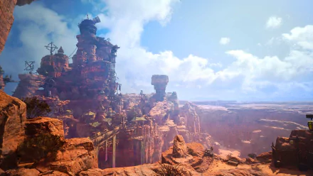 HD desktop wallpaper of a scenic view from Final Fantasy VII Rebirth showcasing expansive desert landscape with towering rock formations and a mystical structure under a clear blue sky.