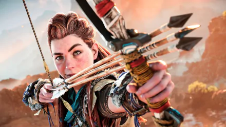 Aloy from Horizon Forbidden West aiming her bow, in a high-definition desktop wallpaper featuring the vibrant, post-apocalyptic game world.